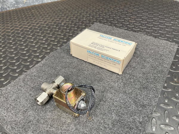 Valcor Scientific 91C89C-7C solenoid valve with wire leads next to its original packaging.