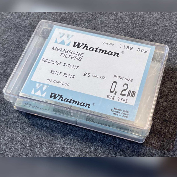 Label reads Cat No 7182 002, cellulose nitrate, white plain, 25 mm dia., 0.2 µm pore, WCN type, 100 circles, made in Japan.