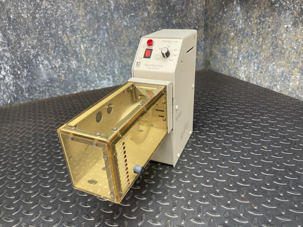Isco Restrictor Heater unit with a beige chassis and clear amber protective shroud extending from the front. (107 characters)