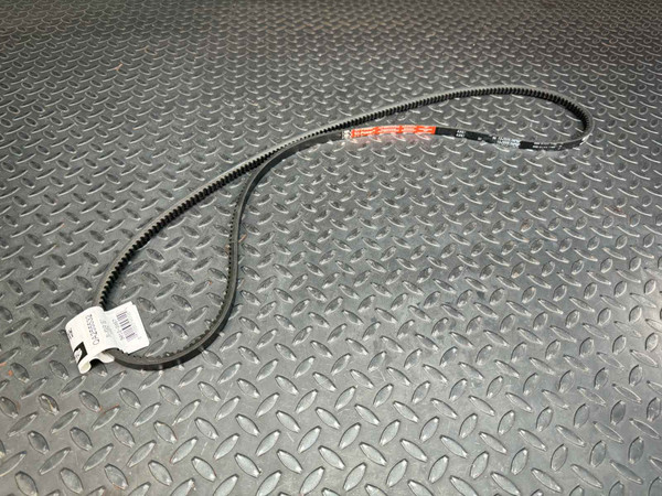 Gates Tri-Power AX67 V-Belt, 1/2 x 69 inches, laid out on a diamond plate surface, with labels visible.