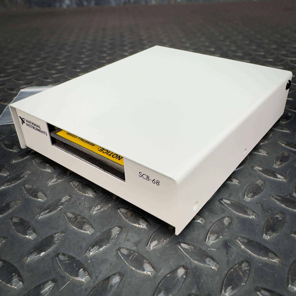 National Instruments NI SCB-68 terminal block connector with white casing and "SCB-68" printed on the side.