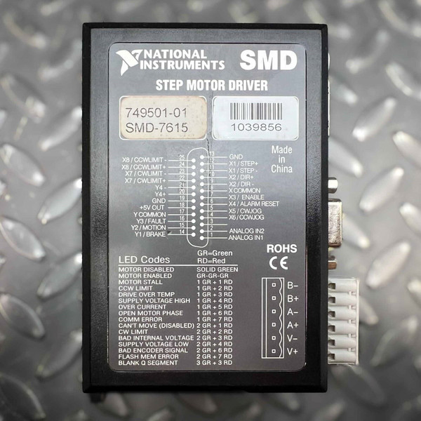 A topdown view of a black National Instruments SMD7615 Stepper Motor Driver, model 74950101, displayed on a textured metallic diamond plate background. The product label prominently features the National Instruments logo, 'SMD STEP MOTOR DRIVER', and part number 74950101 with model SMD7615. A barcode with the serial number 1039856 is also visible. The label includes a detailed pinout diagram for a 25pin Dsub connector, listing inputs/outputs such as GND, X1/STEP, X2/DIR, X3/ENABLE, X4/ALARM RESET, X5/CWJOG, X6/CCWJOG, Y3/FAULT, and various limit switch connections. Below the pinout is a comprehensive list of LED codes indicating operational statuses like MOTOR DISABLED (Solid Green), MOTOR ENABLED (GRGRGR), DRIVE OVER TEMP, OVER CURRENT, and FLASH MEM ERROR, showing combinations of green (GR) and red (RD) lights. The right side of the label indicates 'Made in China' and displays 'ROHS CE' compliance marks. A 6pin power connector with labeled terminals B, B, A, A, V, and V is visible on the right edge of the unit. This essential motion control component is ideal for industrial automation systems.