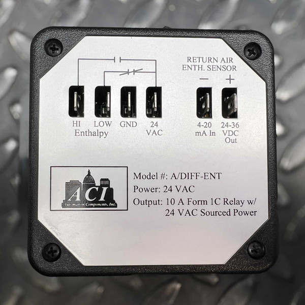 A detailed closeup of the ACI Automation A/DIFFENT Differential Enthalpy Control module, presented in a rugged black plastic enclosure with a silver metal faceplate. The faceplate displays a clear wiring diagram and screw terminals for HI Enthalpy, LOW Enthalpy, GND, 24 VAC power input, and a Return Air Enthalpy Sensor connection with 420 mA input and 2436 VDC output. The label specifies "Model : A/DIFFENT", "Power: 24 VAC", and "Output: 10 A Form 1C Relay w/ 24 VAC Sourced Power". This building automation and HVAC sensor device is designed for precise enthalpy measurement and energy management.