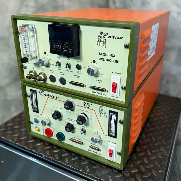 A vintage Dimetrics Orbital Welding Centaur 75 TIG Welder system, featuring two stacked units: the upper Centaur Sequence Controller (model 7001) with a clear gas flow meter, digital counter, and various control knobs for gas and water flow, weld time, and remote connections; and the lower Centaur '75' (model 7008) weld current control unit with two analog meters, multiple knobs for precise weld current, low pulse width, low pulse frequency, and background current, along with colorcoded input jacks and a pulse welding diagram. Both robust industrial units feature olive green front panels, beige control panels, orange side chassis, and red rocker AC power switches, showcasing a comprehensive orbital welding power supply for automated TIG welding applications.