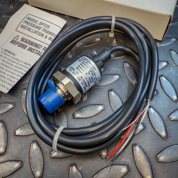 ProSense SPT25 Pressure Transmitter, model SPT25-10-V30A from Obtainium Science and Surplus, shown coiled with its attached black cable, blue protective cap on the sensor tip, and installation manual on a textured metal surface.