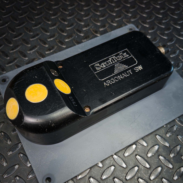 SonTek Argonaut SW sensor with three yellow transducer faces resting on a gray plate