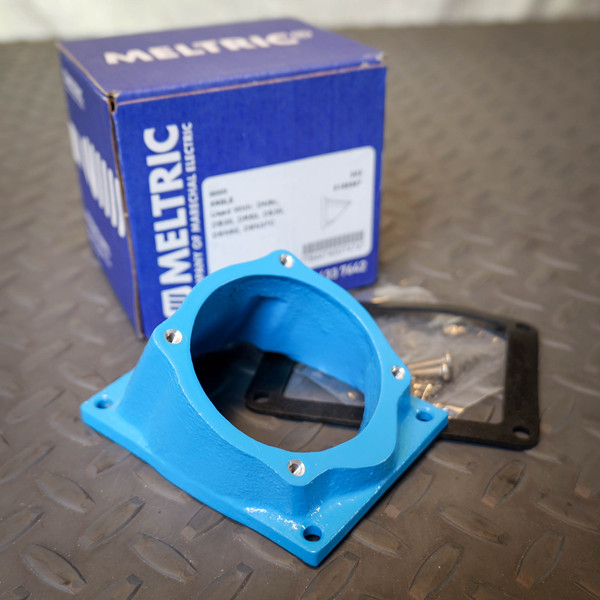 Meltric 593M3 angle adapter showing new, unused condition with bright blue finish. Includes gasket and hardware in bag.