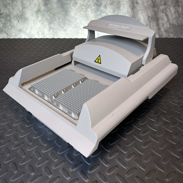 Applied Biosystems GeneAmp PCR System 9700 Dual 384-Well Block N8050400R from Obtainium Science and Surplus shown at an angle, featuring the open heated lid and dual 384-well aluminum plate.