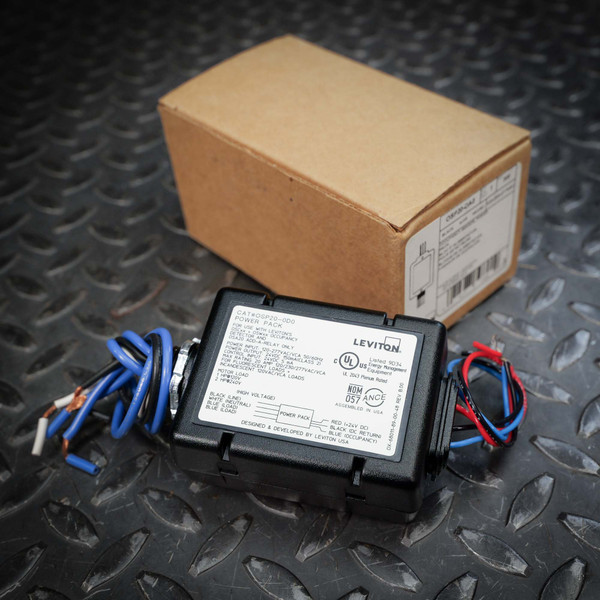 Leviton OSP20-DA0 20A power pack with wiring leads and product label visible, next to its original box.