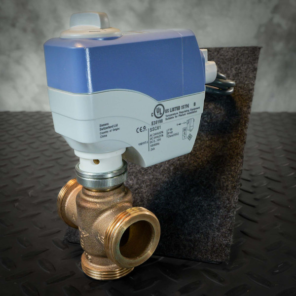 Siemens SSC61 actuator mounted on a three-port brass-tone valve body, side view