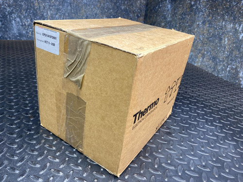 Sealed cardboard box with the Thermo ACT5 Dosimeter Reader for EPD Mk2, G, and N2 from Obtainium Science and Surplus, marked with "Thermo" branding, placed on a textured black surface.