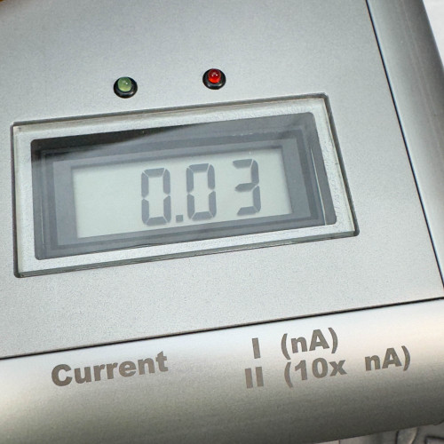 Digital display on the ProTec showing a current reading of 0.03 nA, with green and red indicator lights above, and the label "Current I (nA) II (10x nA)" below.