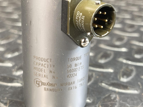 Close-up of a Norbar 5000-2ETS Torque Transducer – 50 LBF·IN, 1/4" Drive from Obtainium Science and Surplus, highlighting the metal body with printed specifications and an attached connector with exposed metal pins.