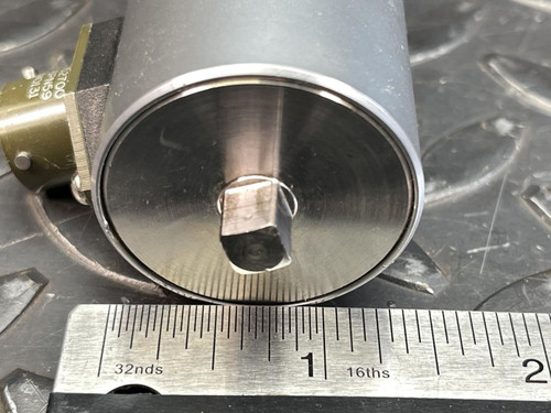 A side view of the Norbar 5000-2ETS Torque Transducer – 50 LBF·IN, 1/4" Drive from Obtainium Science and Surplus, positioned beside a ruler, with the square drive head visible at the top.