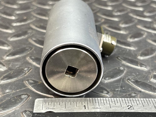 The Norbar 5000-2ETS Torque Transducer – 50 LBF·IN, 1/4" Drive from Obtainium Science and Surplus, lying horizontally next to a ruler for size comparison, displaying the square drive interface.