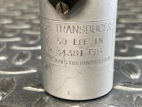 A closer look at the engraved text on the Norbar Torque Transducer, indicating its capacity as 50 LBF·IN and providing its model number and other details.