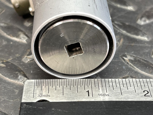 The bottom end of the Norbar Torque Transducer with a square 1/4" drive, positioned next to a ruler for size reference.