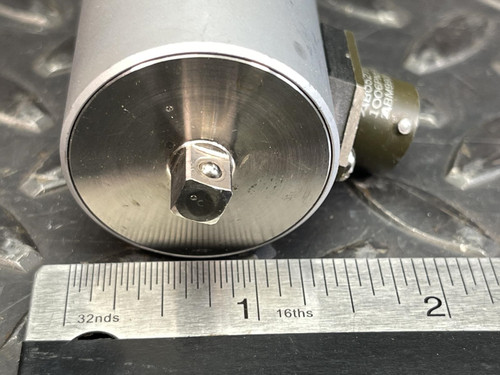 Close-up of the top end of the Norbar Torque Transducer, featuring a protruding square drive, with a ruler placed alongside for scale.
