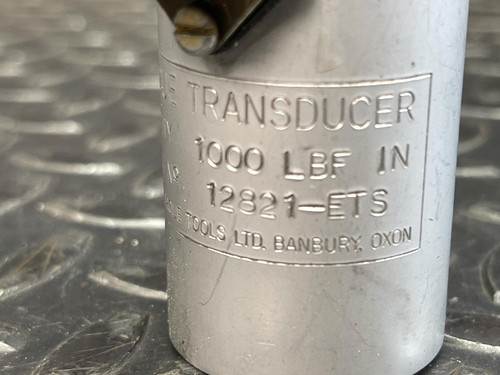 Detailed view of the Norbar Torque Transducer, showing the engraved 1000 LBF·IN specification and product markings on the metallic surface.