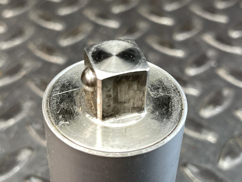 The top view of the Norbar Torque Transducer, highlighting the square drive protruding from the cylinder’s flat surface.