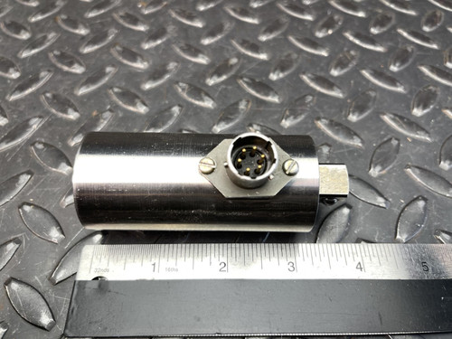A horizontal view of the Norbar Torque Transducer with 1/2" drive, placed next to a ruler on a textured metal surface, from Obtainium Science and Surplus.