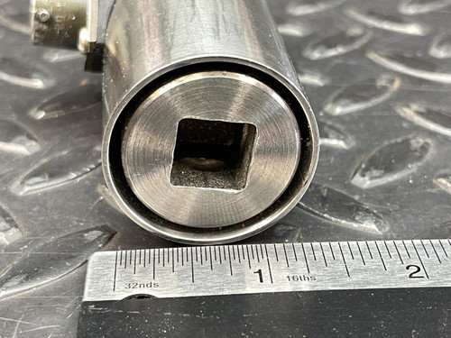 Close-up view of the square 1/2" drive end of the Norbar Torque Transducer, showing fine metallic detailing and ruler for scale, from Obtainium Science and Surplus.