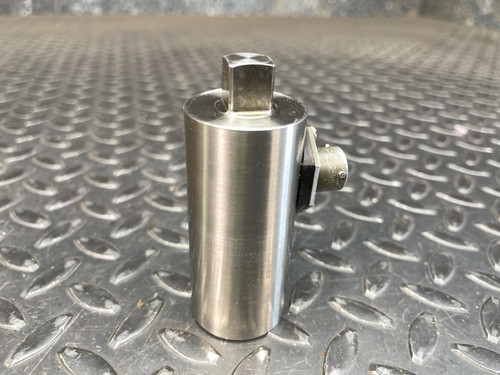 A second upright view of the Norbar Torque Transducer with 1/2" drive and side connector, resting on a metal surface, from Obtainium Science and Surplus.