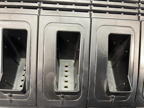 Close-up of the Thales battery charger for MBITR tactical radios from Obtainium Science Surplus, focusing on the charging slots.