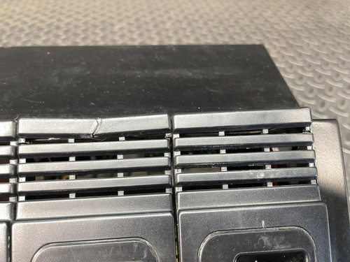 Close-up of the Thales battery charger for MBITR tactical radios from Obtainium Science Surplus, showing the top ventilation grilles.