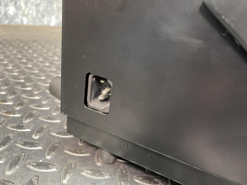 Detail of the Thales battery charger for MBITR tactical radios from Obtainium Science Surplus, showing a small rectangular port on the side.