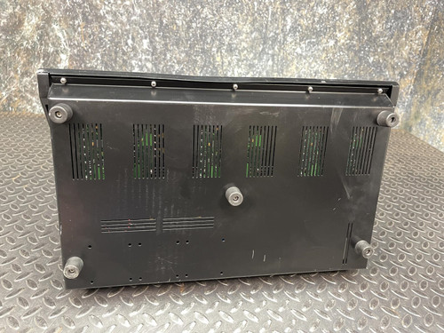 Rear view of the Thales battery charger for MBITR tactical radios from Obtainium Science Surplus, displaying ventilation grilles and feet.