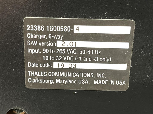 Close-up of a label on the Thales battery charger for MBITR tactical radios from Obtainium Science Surplus, indicating model and specifications.