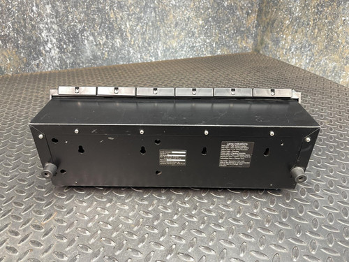 Rear view of a Thales battery charger for MBITR tactical radios, showing details of the back panel.