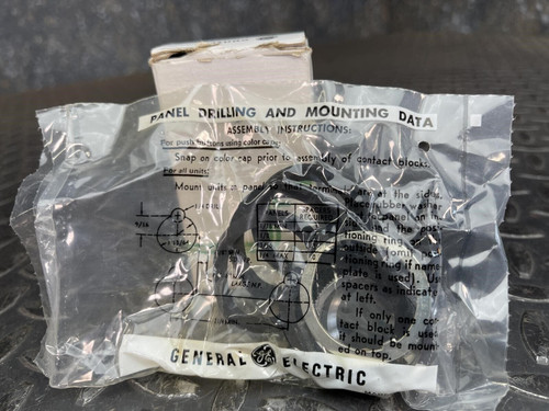 Plastic-wrapped components of the GE 3-Position Oil-Tight Switch - Model CR2940UB200B from Obtainium Science and Surplus, with printed installation instructions visible.