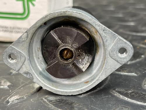 Detailed view of the rear section of the GE 3-Position Oil-Tight Switch - Model CR2940UB200B, revealing the internal rotating mechanism inside the metal casing.