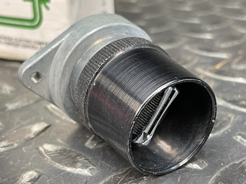Close-up side angle of the GE 3-Position Oil-Tight Switch - Model CR2940UB200B, showing the textured metal ring around the switch’s black plastic housing.