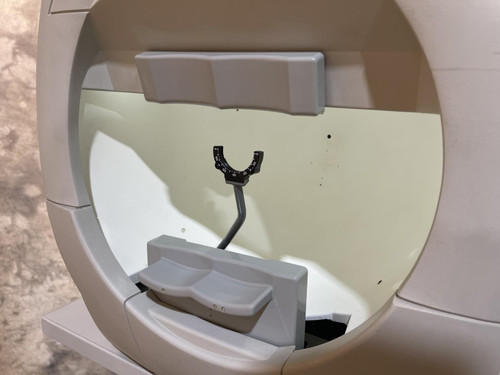 A close-up view of the Carl Zeiss Meditec Humphrey Visual Field Analyzer 750i, showing the circular testing area with head and chin supports.