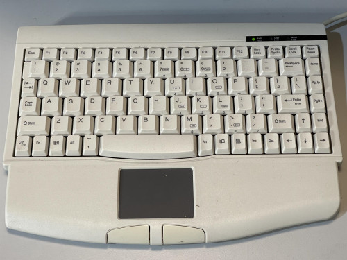 The keyboard of the Carl Zeiss Meditec Humphrey Visual Field Analyzer 750i, featuring a compact design with a built-in touchpad.