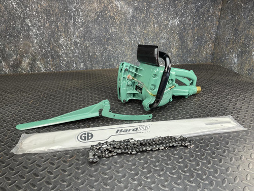 CS Unitec Pneumatic Chainsaw from Obtainium Science and Surplus, displayed on a textured surface with its chain and guide bar detached and placed in front.