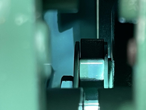 Close-up of the internal mechanism of the CS Unitec Pneumatic Chainsaw from Obtainium Science and Surplus, highlighting the chain movement area.