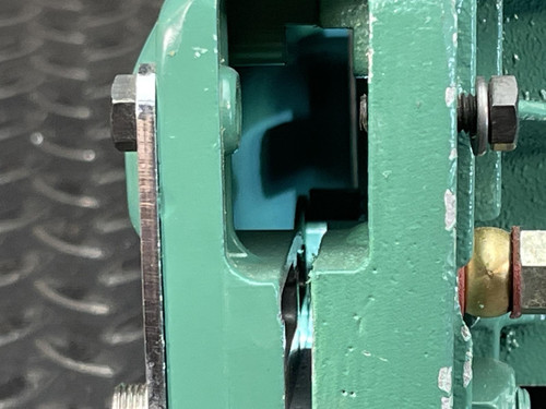 Side view of the CS Unitec Pneumatic Chainsaw from Obtainium Science and Surplus, focusing on the chain guide and its attachment.