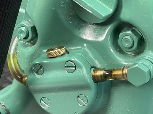 Detailed image of the CS Unitec Pneumatic Chainsaw from Obtainium Science and Surplus, showing the oil lubrication and fittings.