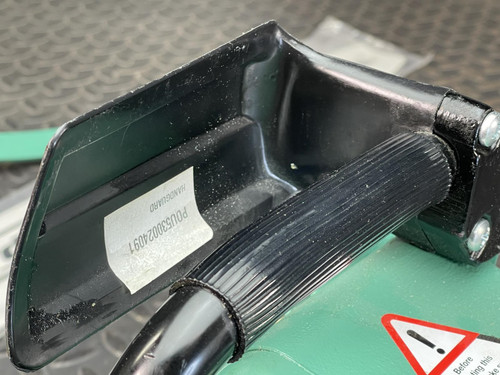 Close-up view of the CS Unitec Pneumatic Chainsaw's handle and attachment parts, highlighting the label 'HardTOP CE Performance Forestry Equipment'.