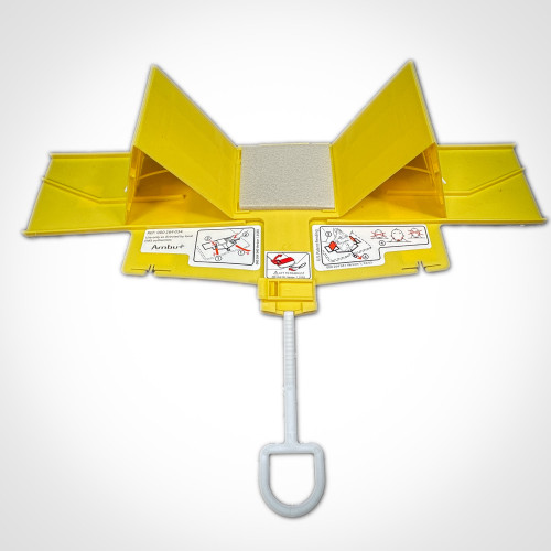 The image displays the Ambu Head Wedge cervical immobilization device fully unfolded and lying flat. This perspective shows the device's bright yellow panels and the gray head cushion at the center. Several instructional diagrams are visible on the device, offering step-by-step guidance on securing and adjusting it around a patient's head. A prominent white handle extends from the base, emphasizing the device's design for easy manipulation and application in emergency medical situations.
