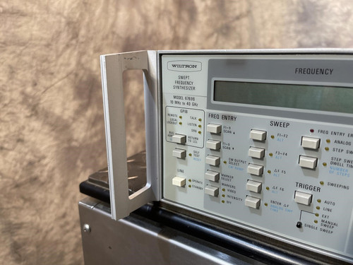 Left side close-up of the Wiltron 6769B Synthesized Sweep Generator from Obtainium Science and Surplus, focusing on the labeled control switches and display.