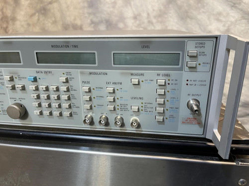 Detailed front panel of the Wiltron 6769B Synthesized Sweep Generator from Obtainium Science and Surplus, highlighting numeric displays and functional dials.