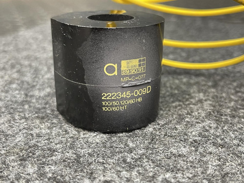 Detailed view of the ASCO Replacement Coil 222345-009-D – 120V HB Series, showing printed text and product information on its black cylindrical body.