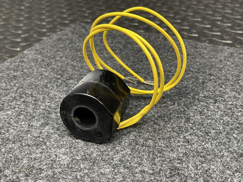 Side perspective of the ASCO Replacement Coil 222345-009-D – 120V HB Series with its yellow wires coiled loosely around the black coil body.