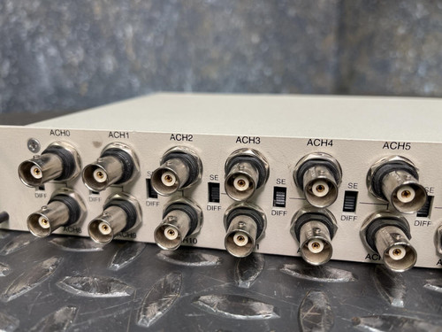 A close-up view of multiple BNC connectors on the National Instruments BNC-2090 terminal block, showing detailed labeling. This item is from Obtainium Science & Industry Surplus.