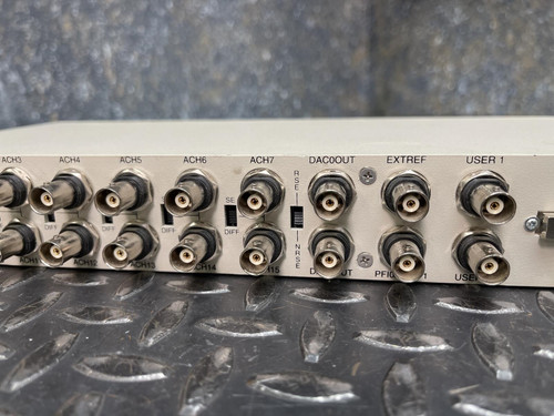 A side view of the National Instruments BNC-2090 terminal block, featuring a row of BNC connectors. This terminal block is available from Obtainium Science & Industry Surplus.